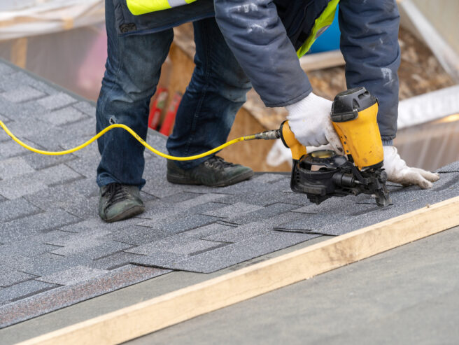 Close up of professional roofer worker performing roof repair for Abe's Roofing & Exteriors in Springfield IL